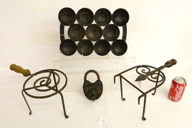 Metalware Lot: Metalware lot including 2 trivets, lock and muffin pan.