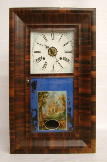 19th c. Waterbury Ogee Clock: 19th c. mahogany case Waterbury Ogee clock. 26" Ht.