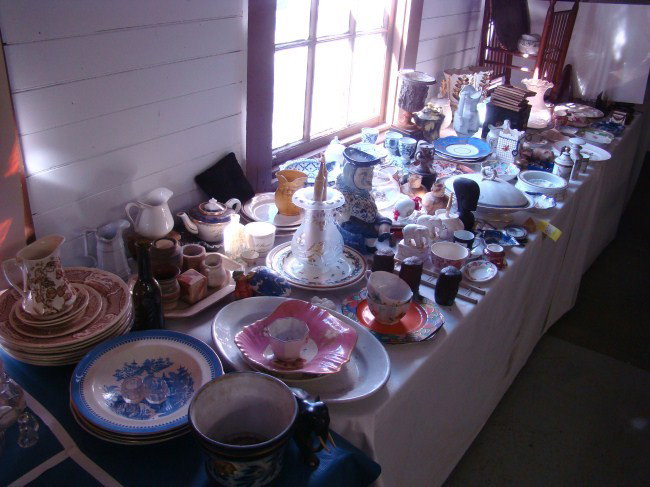Large Table Lot: Large table lot over 100 pcs. including metronome, early teapots, vases, shades, Davenport plate, export dish with painted eagle, figural pitcher, papier mache tray (as found), flow blue dish, bronze
