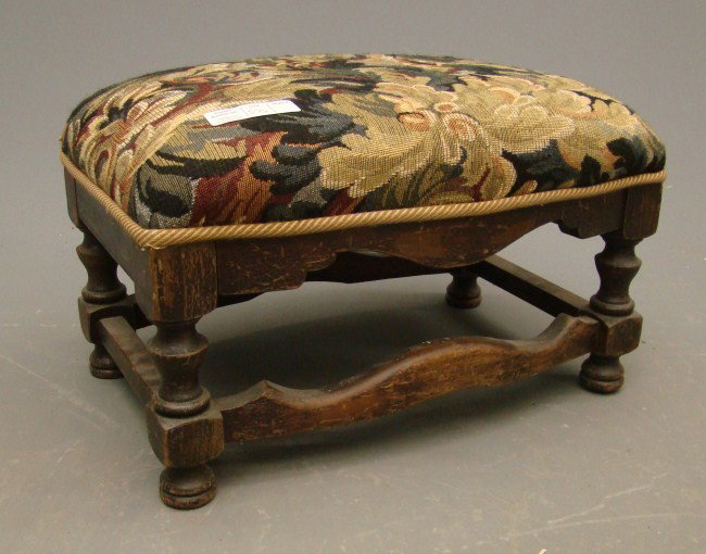 Footstool: Vintage upholstered footstool.