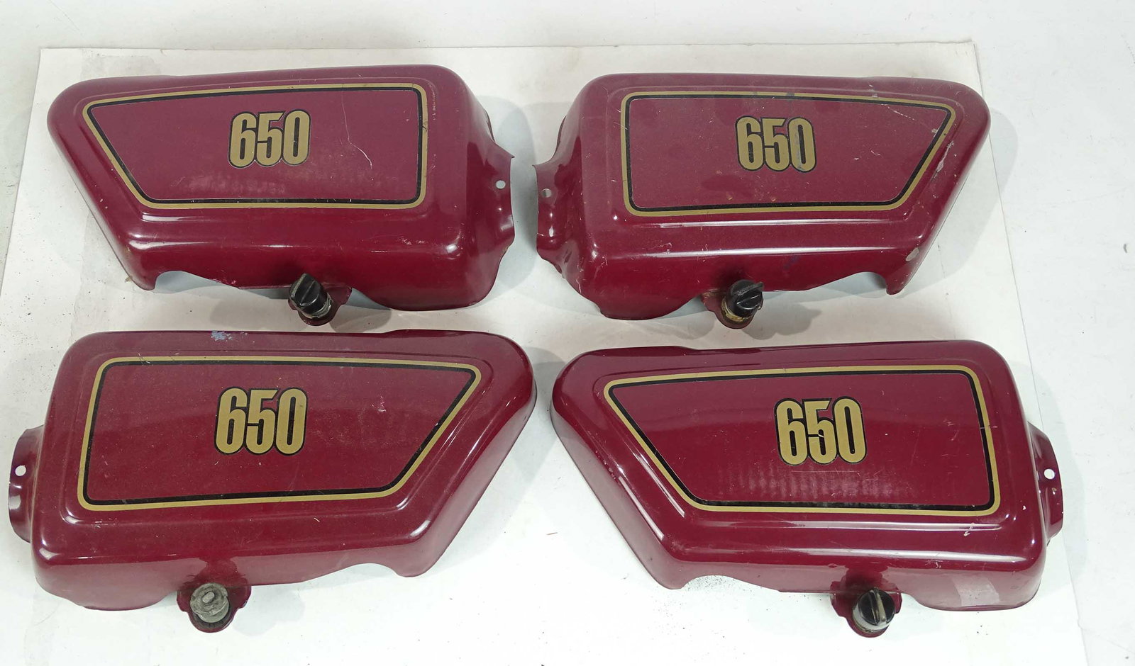 Motorcycle Side Covers: Four "650" motorcycle side covers.