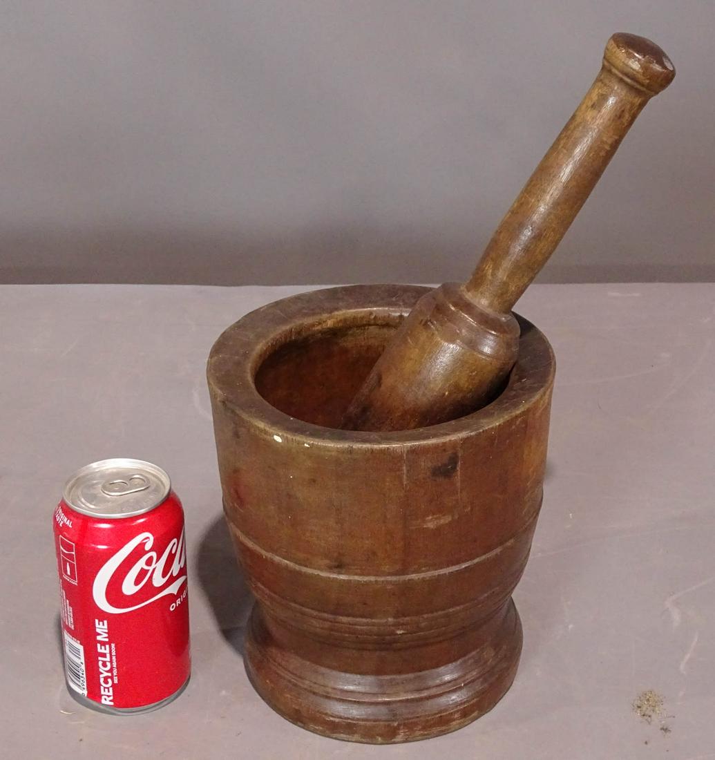 19th c. Morter and Pestle: 19th c. wooden morter and pestle. Morter 7" D., 7 1/4" Ht., pestle 11 1/2" L..