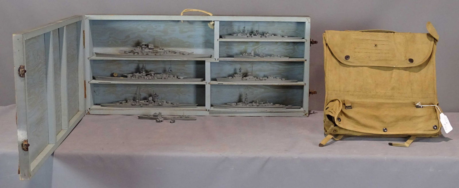 WWII Ship Models: WWII Ship Models in original case. Case marked "SPECIAL DEVICES DIVISION U.S.N. BUREAU OF AERONAUTICS". Case 17" x 37" x 4 1/2", along with Military Satchel field table.