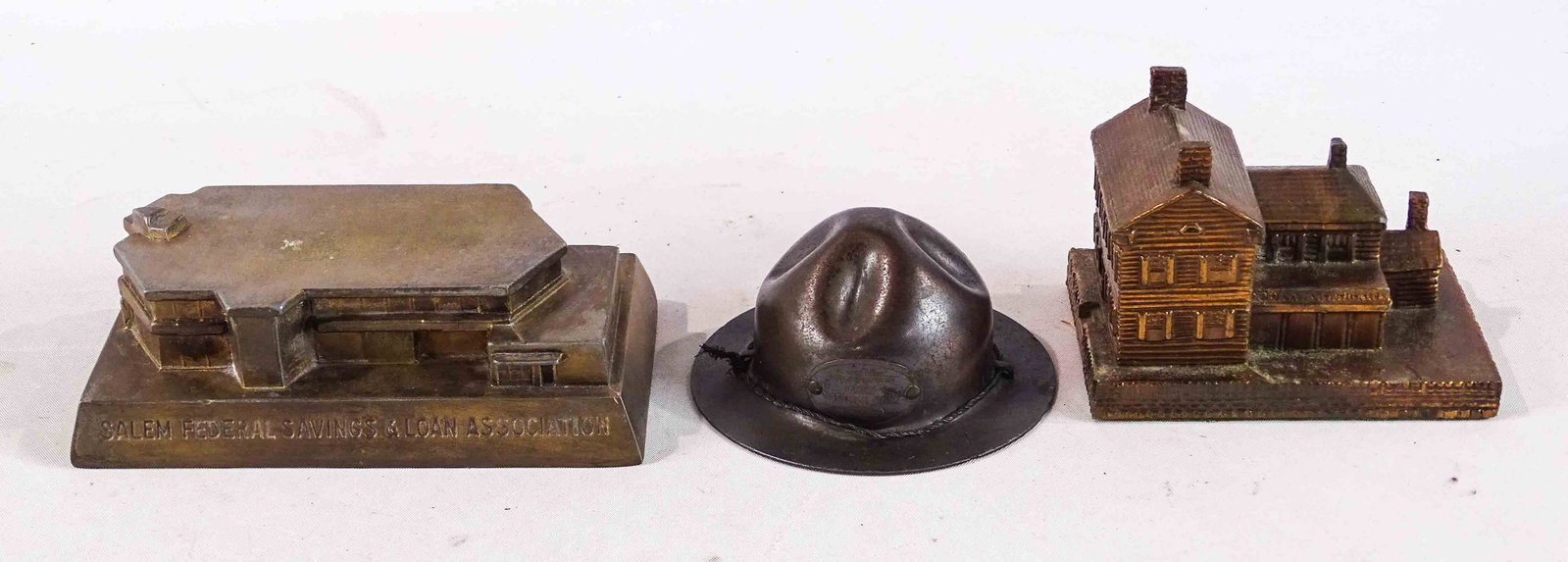 Misc. Lot: Lot (3) banks including Buddy Bank (hat), steel, 1 7/8" Ht., Stronghat, #1399 Penny Bank Book; building paperweight (3" Ht.), cast metal Salem Federal Savings Bank, 1 3/4" Ht., 1961, Banthrico.