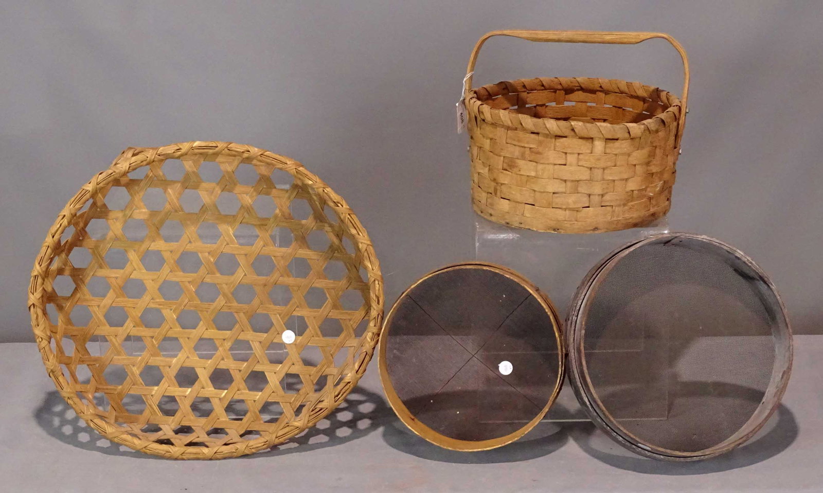 Basket Lot: Lot including cheese basket (minor losses, 24 1/2" D.), basket with handle, (2) sieves.
