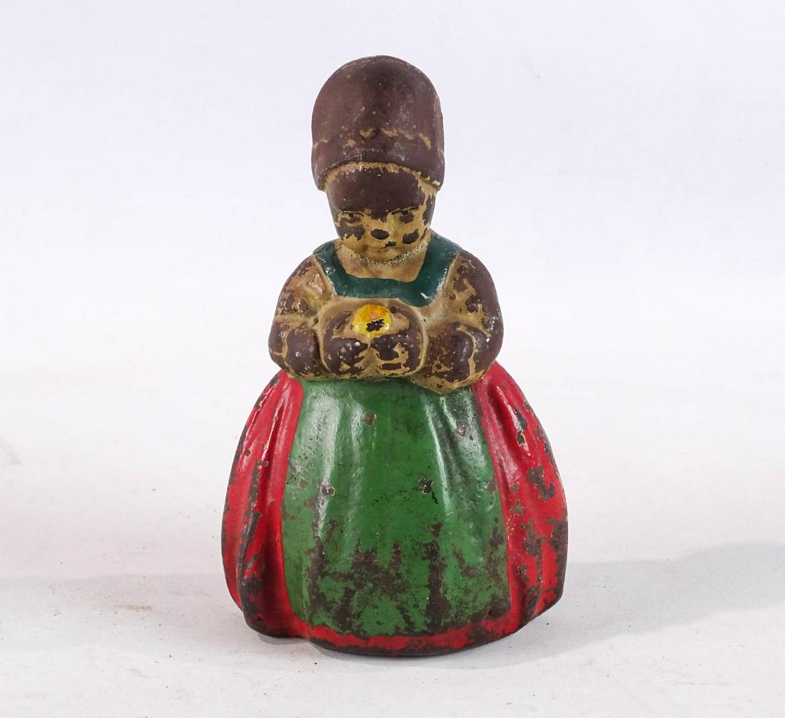 Dutch Girl Doorstop: Cast iron Dutch-Girl doorstop. 6 1/2" Ht..
