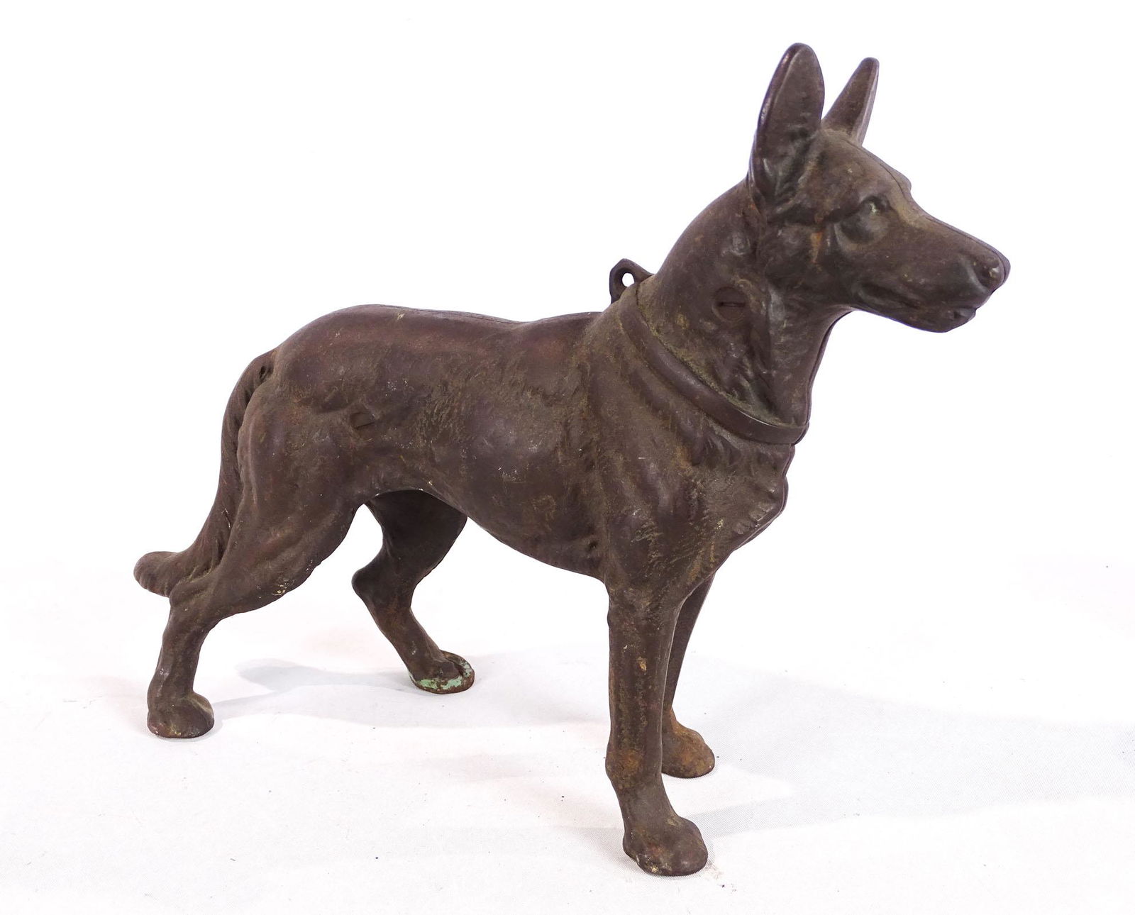 German Shephard Doorstop: Cast iron German Shephard doorstop. Mfg. Hubley, 10" Ht., 12 1/2" L..