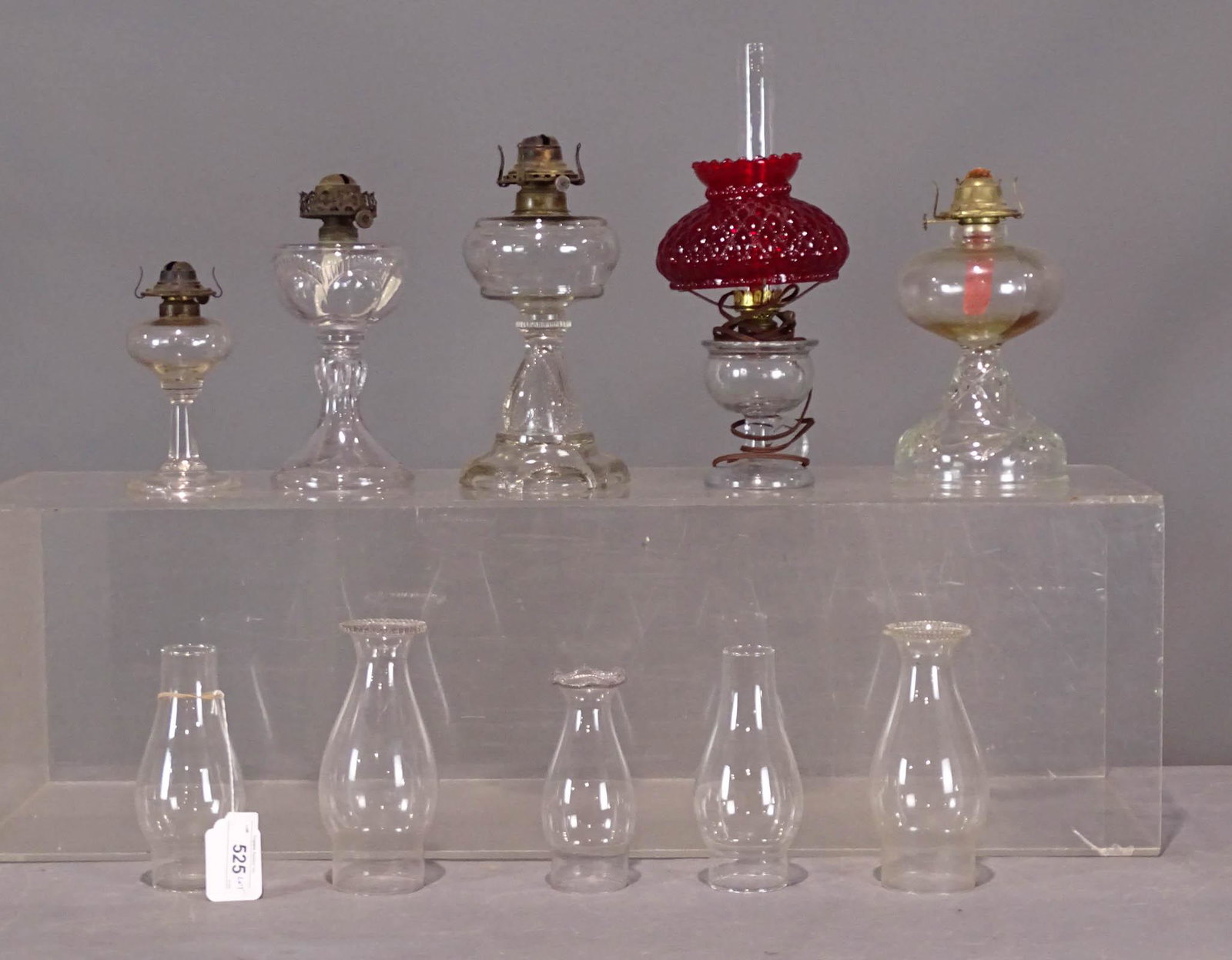 Oil Lamp Lot: Lot of various oil lamps and chimneys.