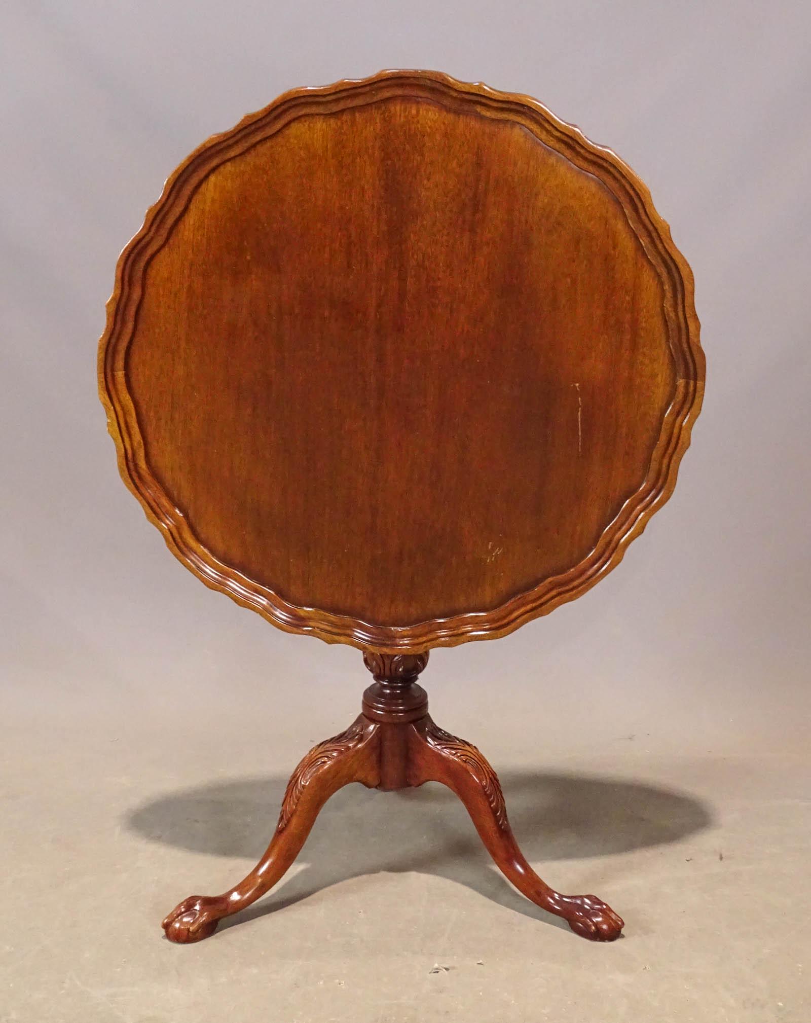 Mahogany Tea Table: 20th Century mahogany tilt top piecrust tea table. 30" D., 30" Ht..