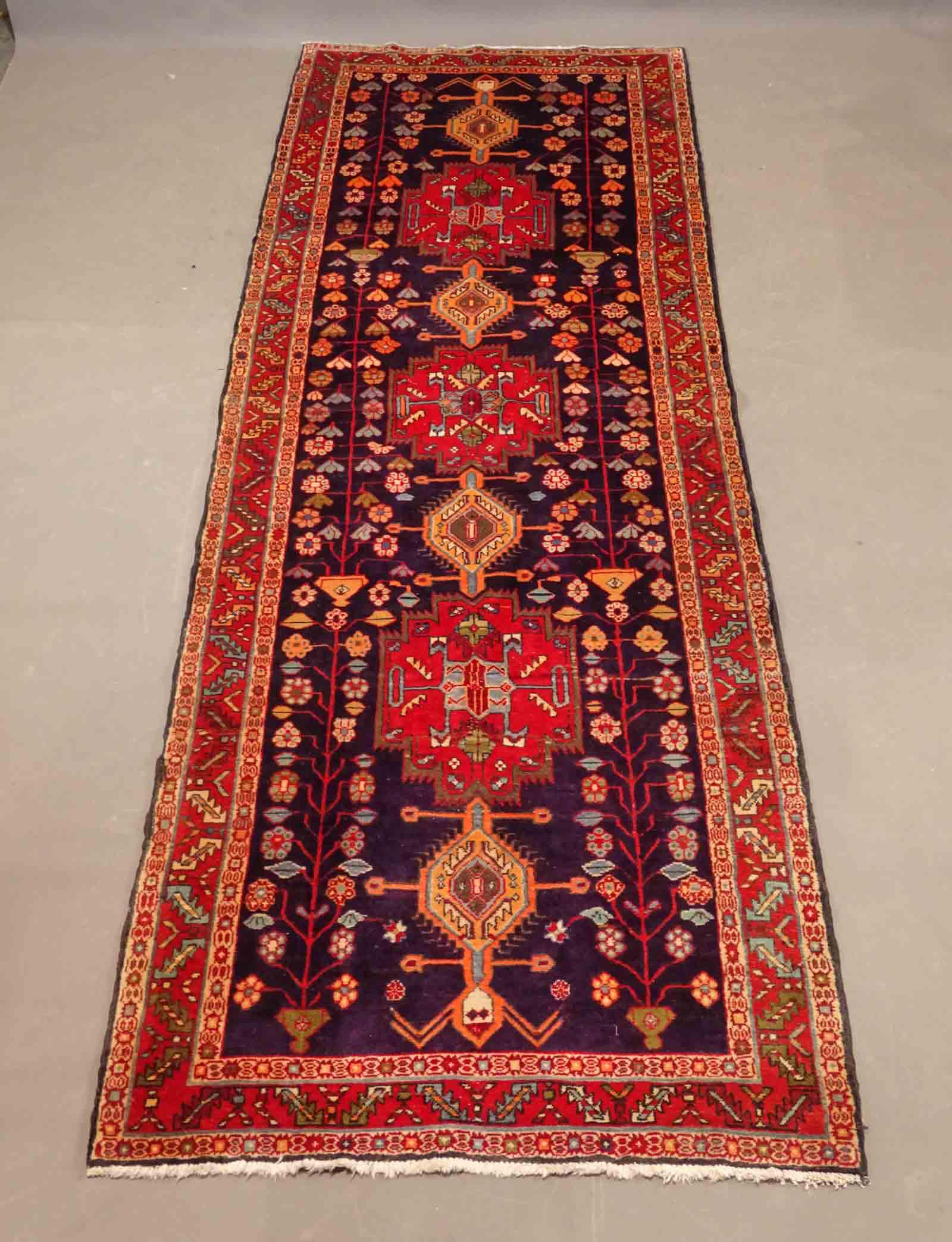 Oriental Rug: Oriental rug. 10' 9" x 3' 11". Property of The Barbara Packer, Estate, Germantown N.Y. and N.Y.C..
