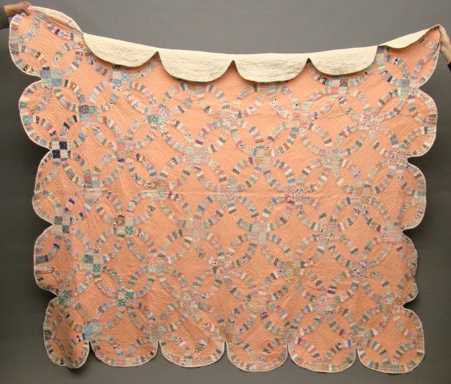 Quilt: C. 1930' s Wedding Ring quilt with embroidered birds on back. 88" x 93".