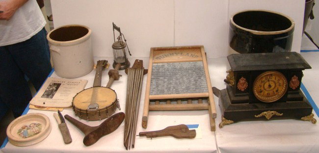 Misc. Lot: Misc. lot including Victorian metal clock, crock, banjo, pickle caster, washboards, drying rack, "Shirley Temple in Heidi" pamphlet etc.