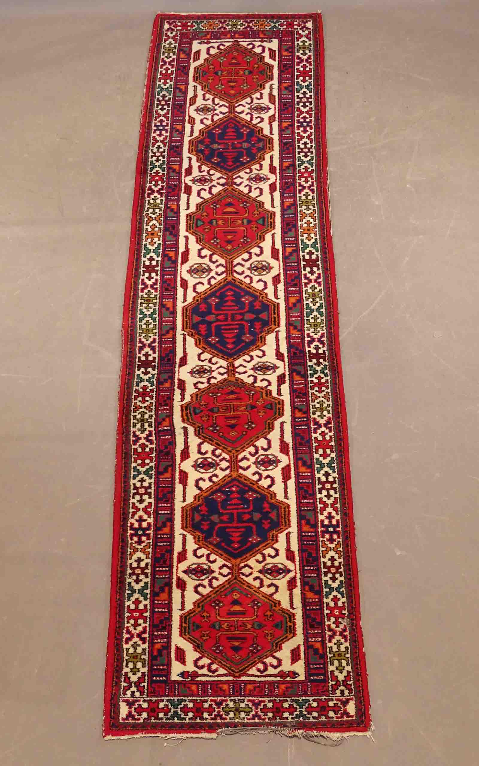 Oriental Rug: Oriental rug runner. 33 1/2" x 12".
