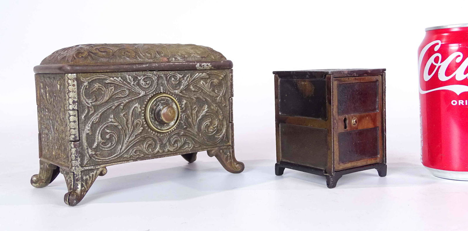 Safe Bank Lot: Still bank lot including: cast iron Toso Panel-Door bank 3 5/8" Ht. C 1890, Mfg. by Columbia Grey Iron Co. and Treasure Box bank 4 5/8"Ht. C. 1889, Mfg. by Hart Co..