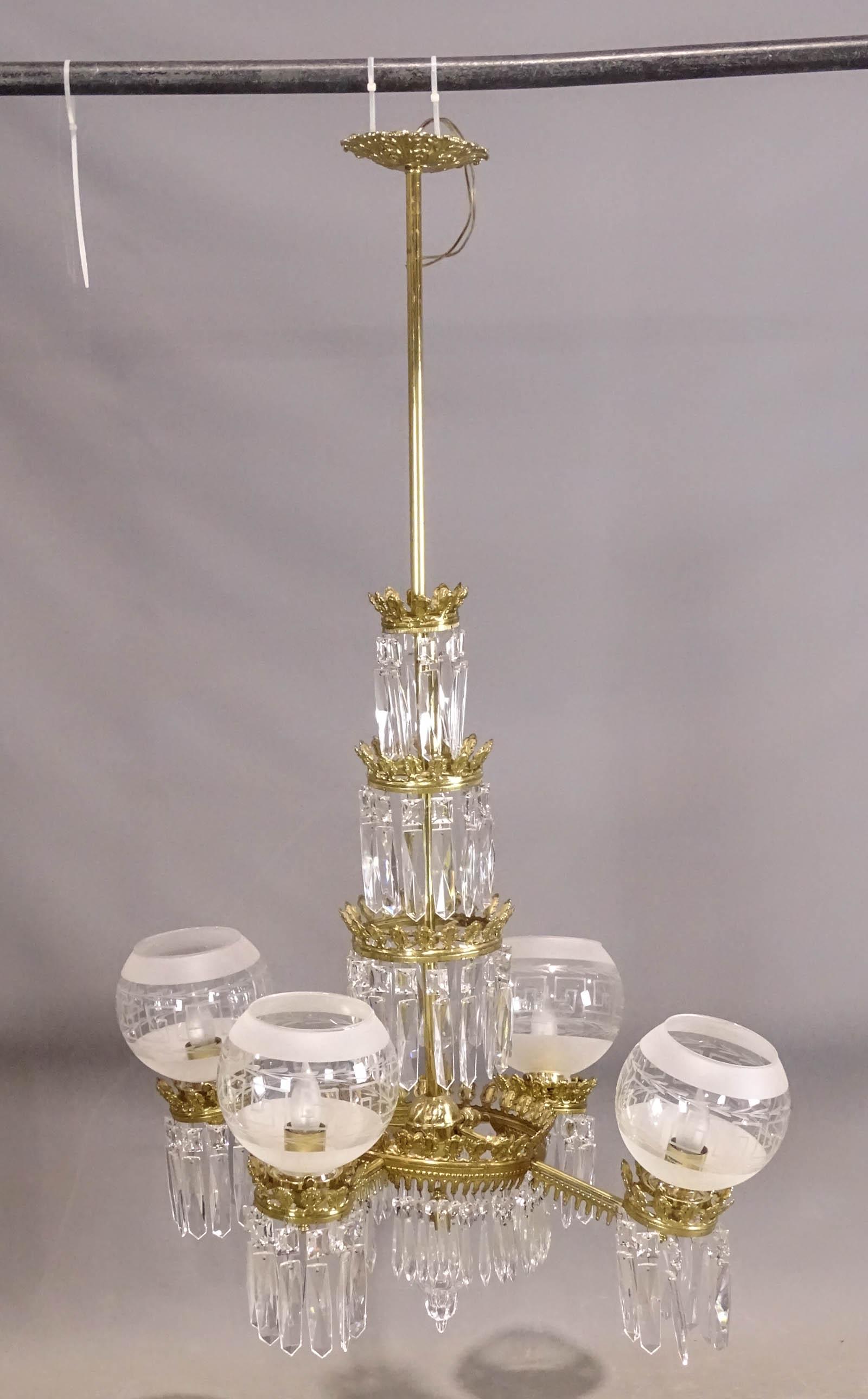 Brass Chandelier: Brass and prism chandelier with shades. 20" D., 46" Ht.. As found needs repair.