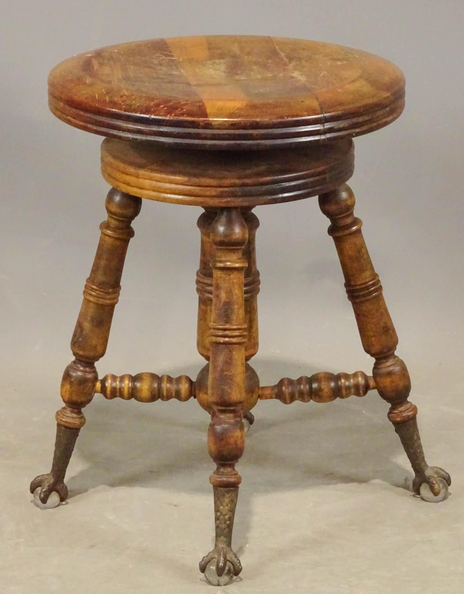Piano Stool: Victorian revolving piano stool. Cast feet. 20" Ht..