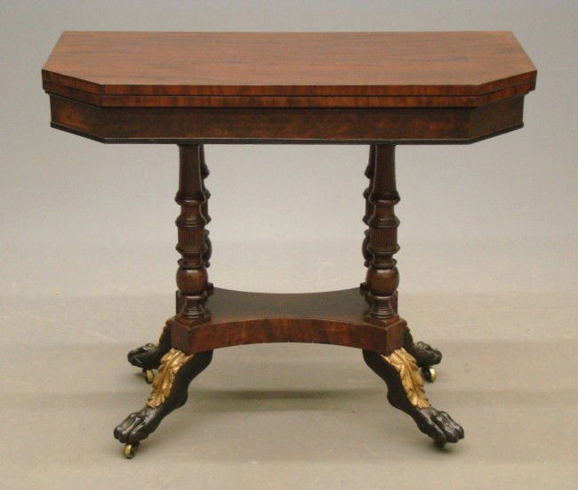 19th c. Duncan Phyfe School Card Table: 19th c. mahogany N.Y.C. school of Duncan Phyfe card table having shaped top supported by 4 colonettes on platform ending in gilt ebonized paw feet. Top 36 x 18" (closed), 30" Ht.