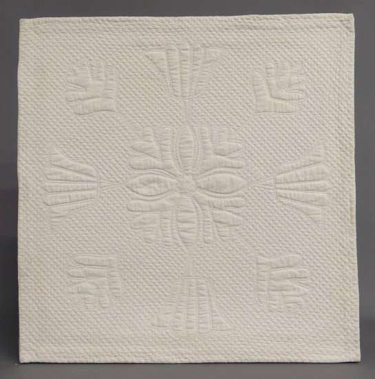 Crib Quilt: 19th c. all white crib quilt with abstract floral design. Mounted 25" x 25 1/2".