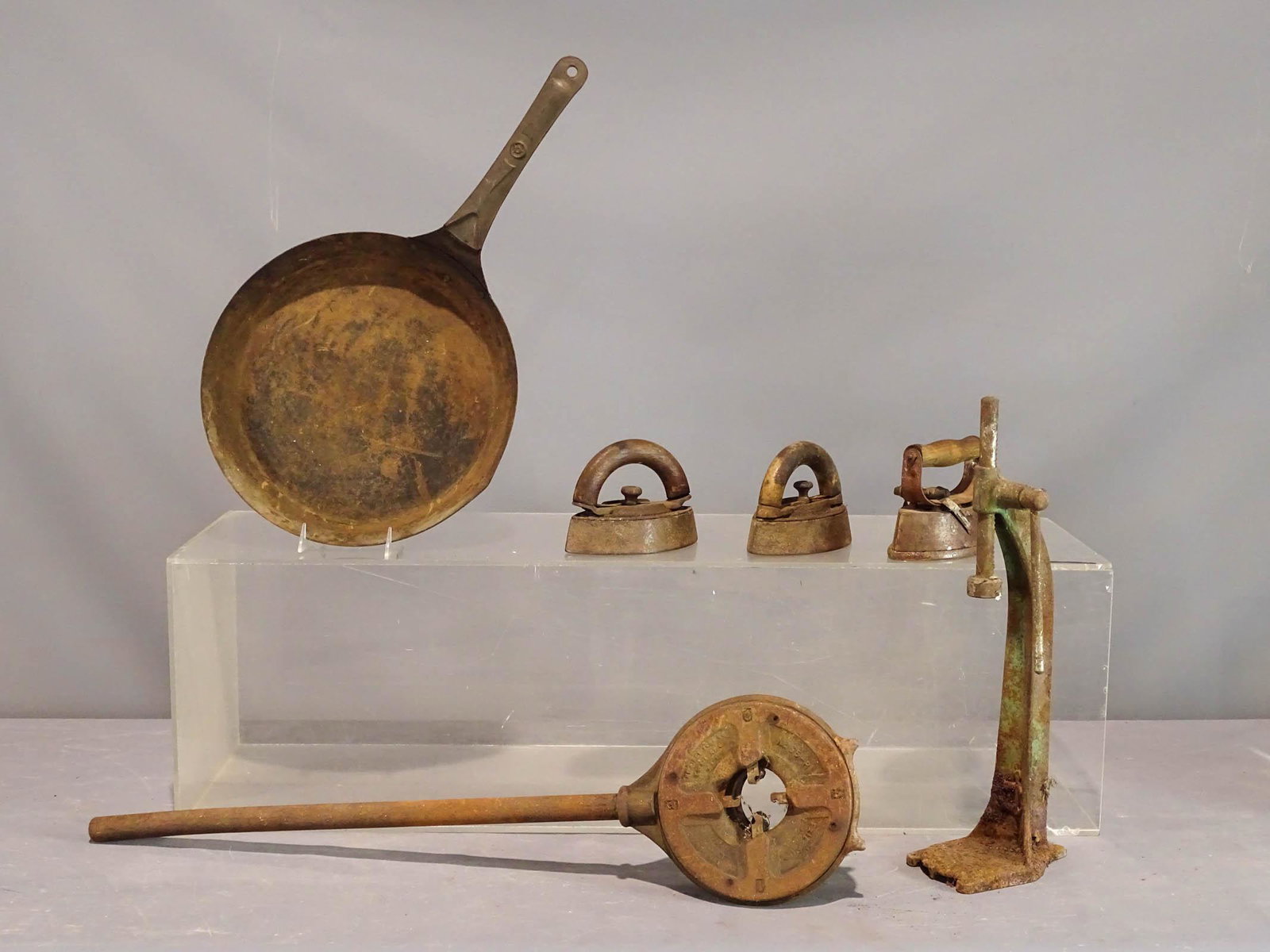 Misc. Lot: Misc. lot including tamper, pipe fitter, early pan and sad irons.