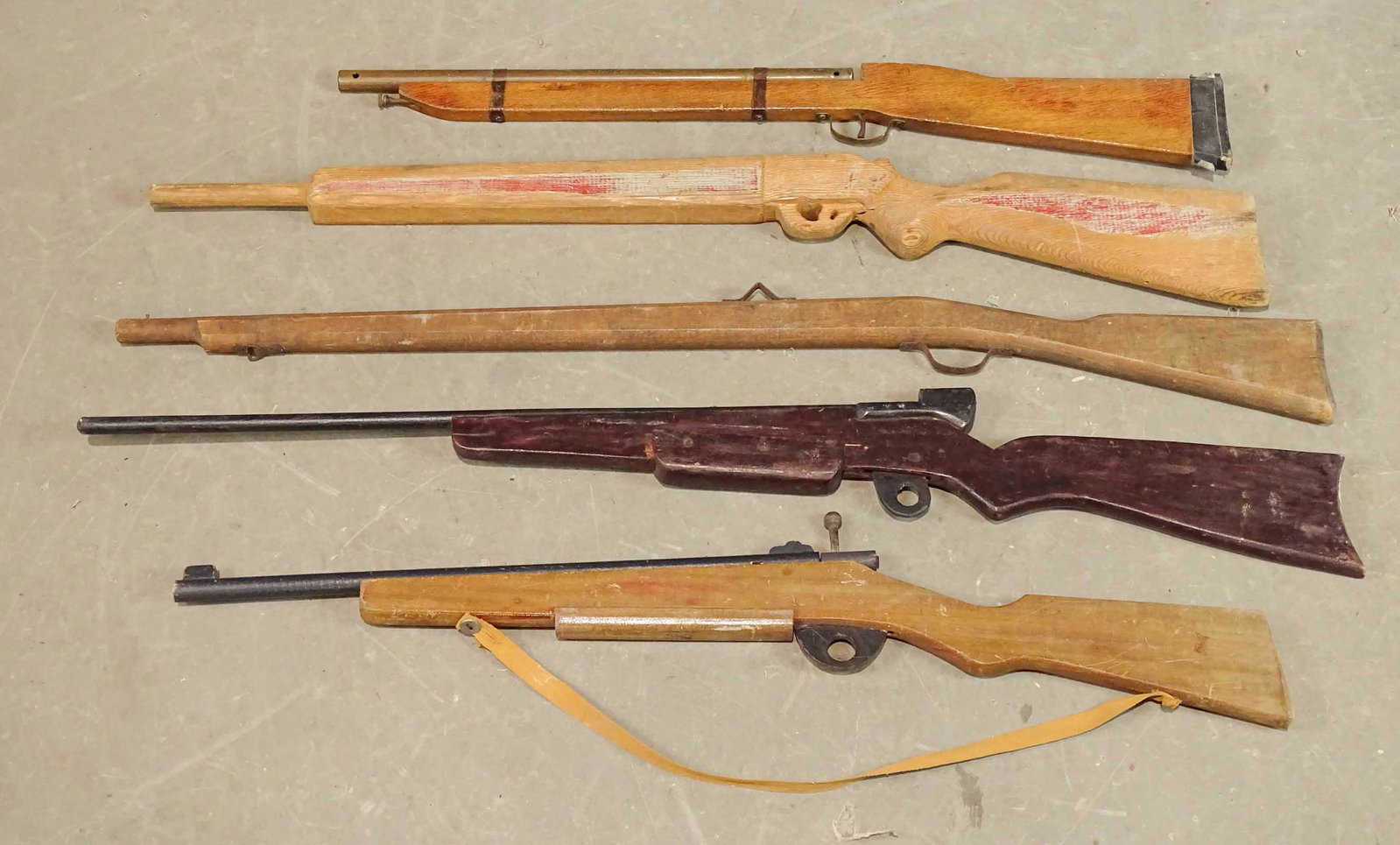 Folk Art Wooden Rifles: Lot (5) folk art wooden rifles. Largest 44" L..