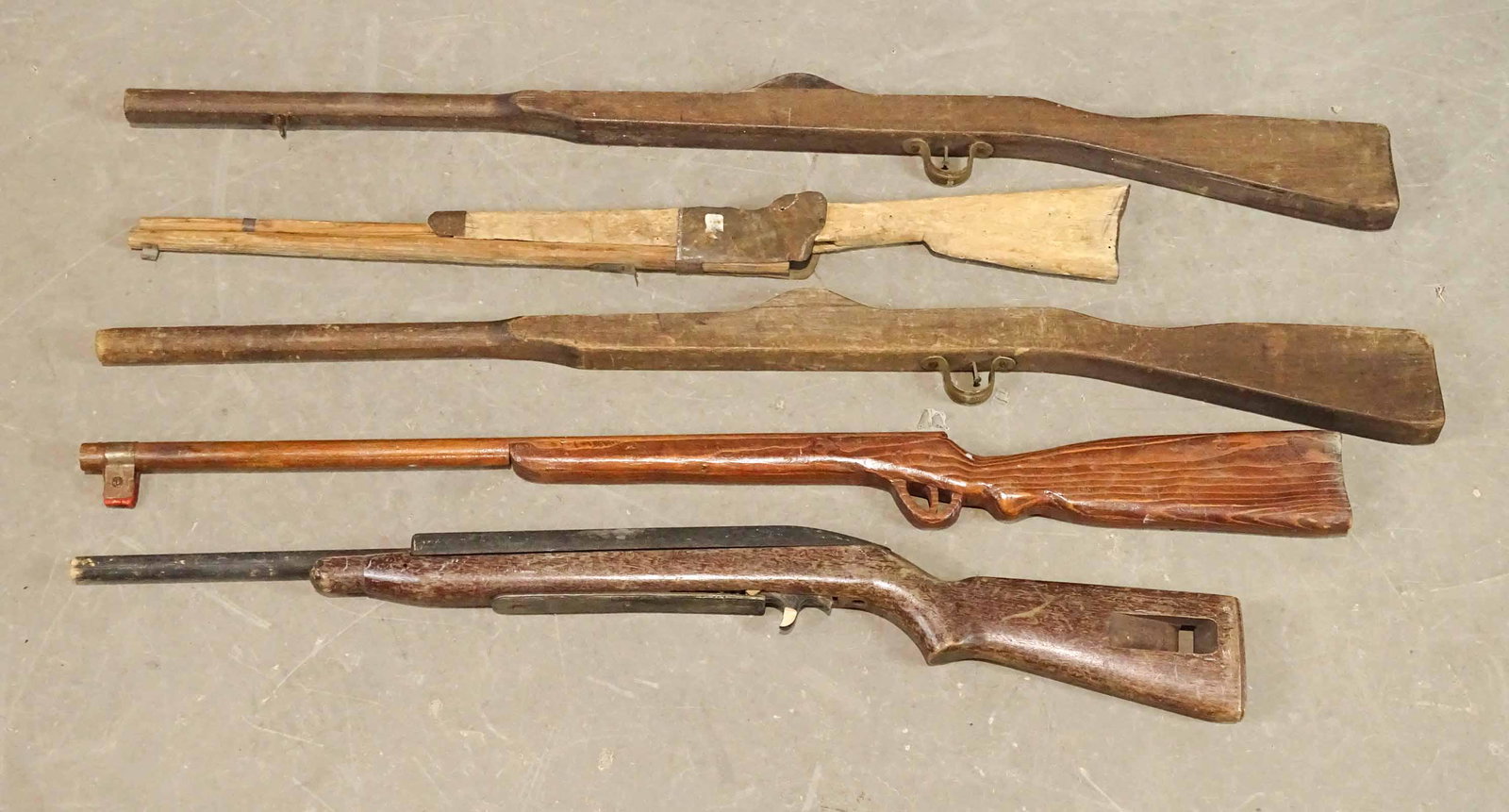 Folk Art Wooden Rifles: Lot (5) folk art wooden rifles. Largest 43" L..