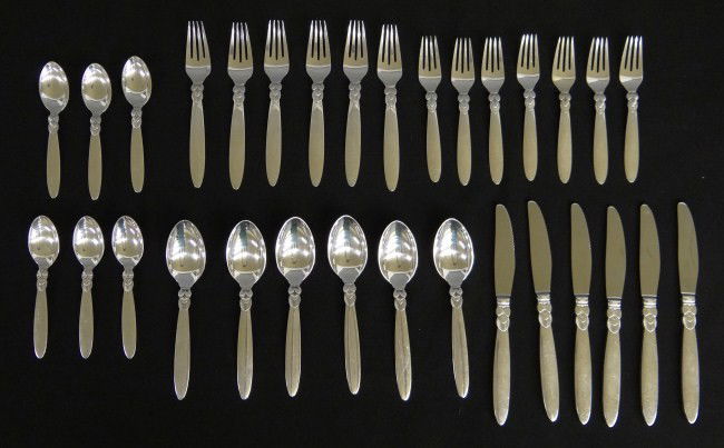 Georg Jensen Sterling Silver Flatwear: Georg Jensen sterling silver service for 6 flatwear "Cactus Pattern". Includes (6) 6" spoons (6) 7 1/4" spoons, (6) 7" forks, (7) 6 1/2" forks, (6) weighted 9" knives. 1261 grams without weighted kniv