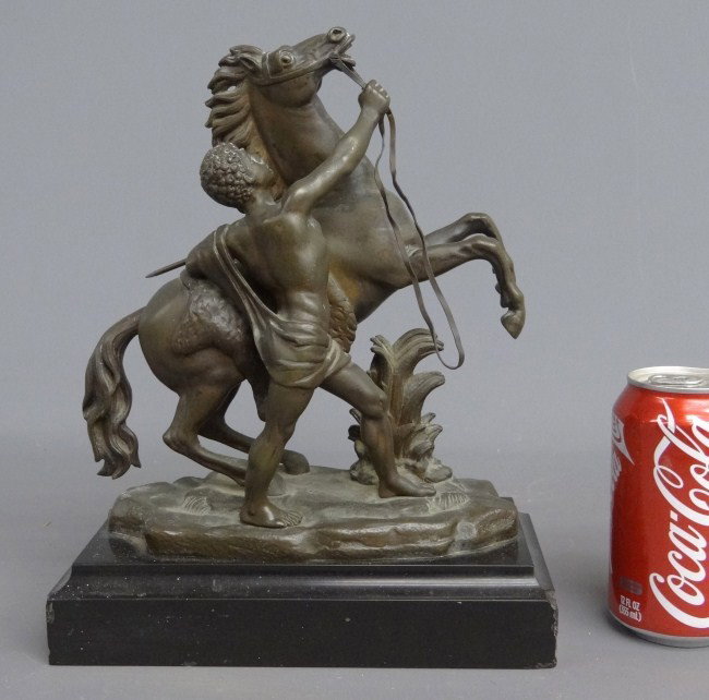 Bronze Horse And Handler: Bronze horse and handler on marble base. 9" W 11" Ht.