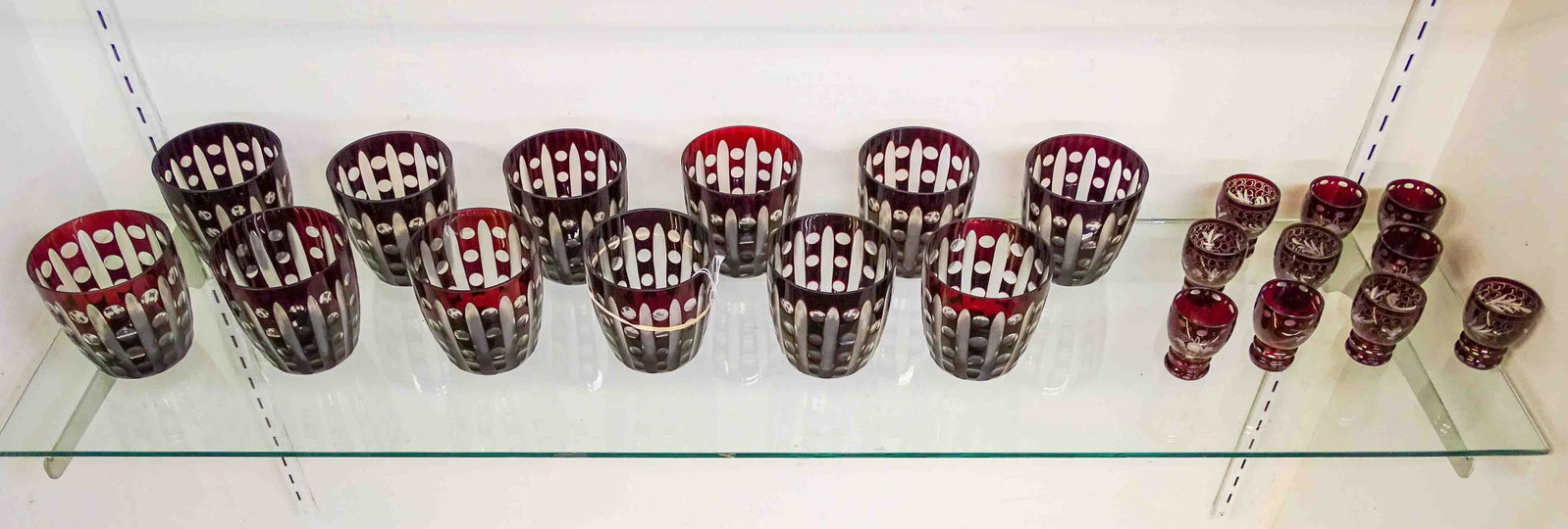 Cranberry Glass Glasses: Lot of Cranberry glasses including (12) glasses and (10) shots.