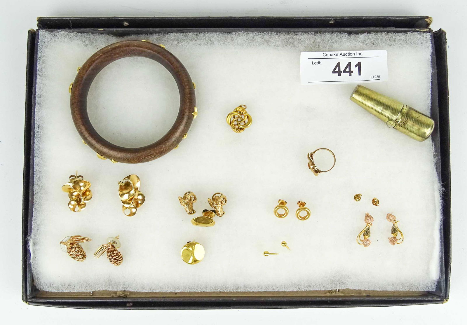 Jewelry Lot: Jewelry lot including: Wooden bracelet with unmarked yellow stars, (7) pair unmarked earrings, pendant, 10 Karat yellow gold bow ring, hallmarked sewing kit. Appraisal value $500.00.