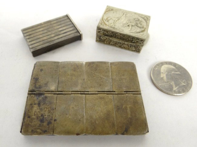 Sterling Silver Lot: Lot including sterling silver Tiffany pill box, sterling 8 door pill box. 75 Grams total weight (and unmarked pill box).