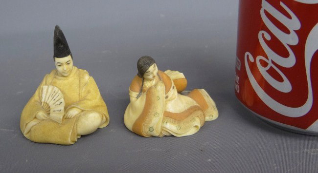 Japanese Netsukes: Japanese seated man and woman Netsukes.