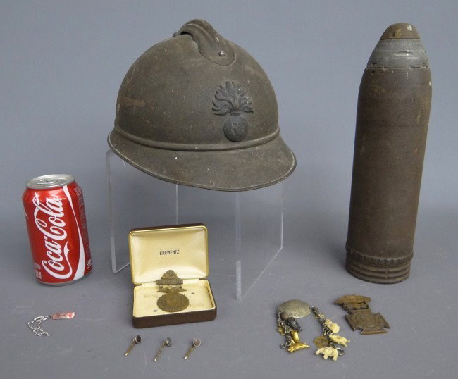 Military Lot: Military lot including early metal helmet, morter and various medals.