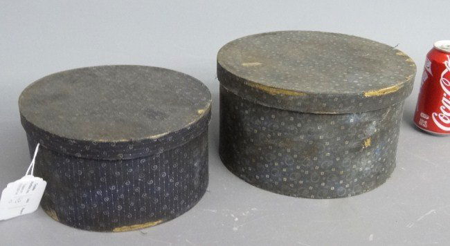 Wallpaper Boxes: Lot (2) early wallpaper boxes in calico blue patterning. 8" and 9 1/2" Diameter.
