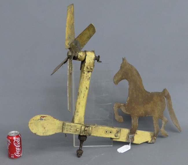 Horse Whirligig: Early horse whirligig in original yellow paint. 34" W 29" Ht.