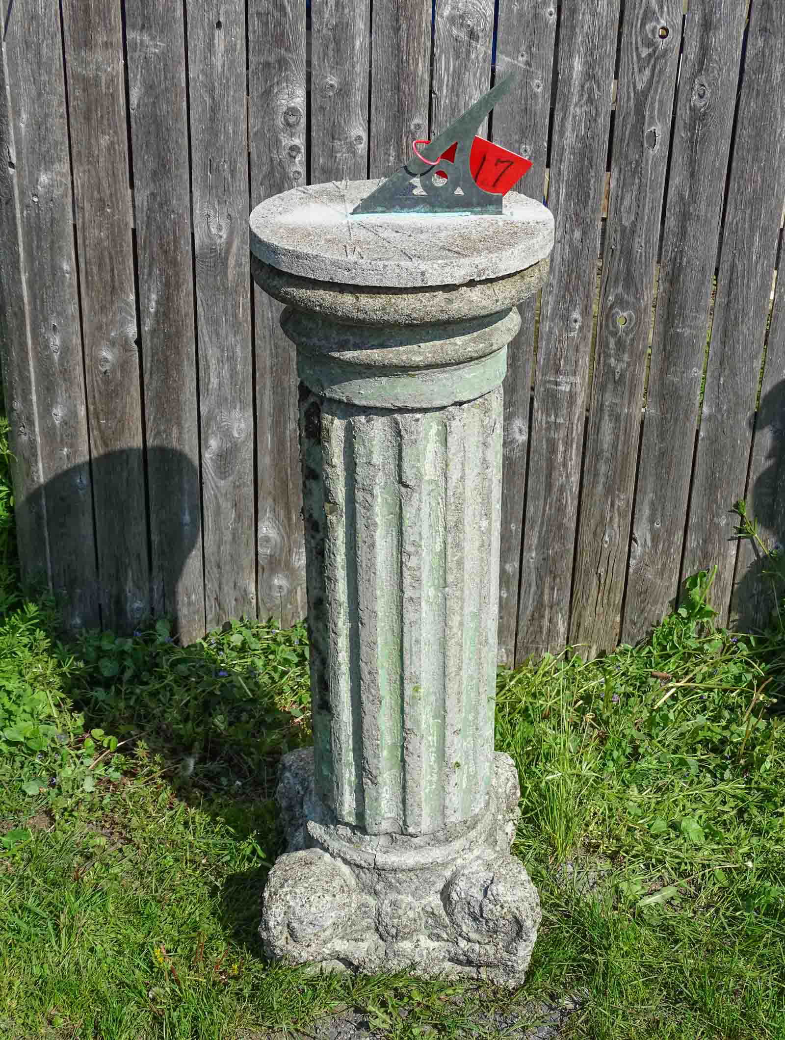 Sundial: Sundial, poured stone base. 47" Ht..