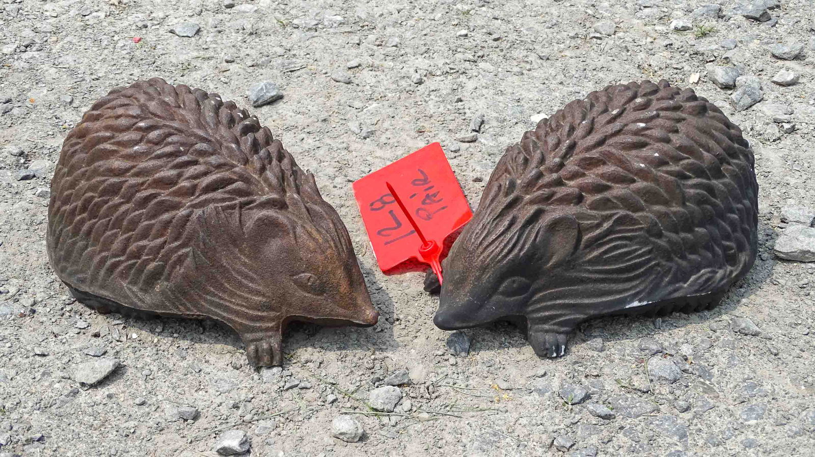 Pair Hedge Hogs: Pair cast iron hedge hogs signed John Wright. 9 1/2" L..