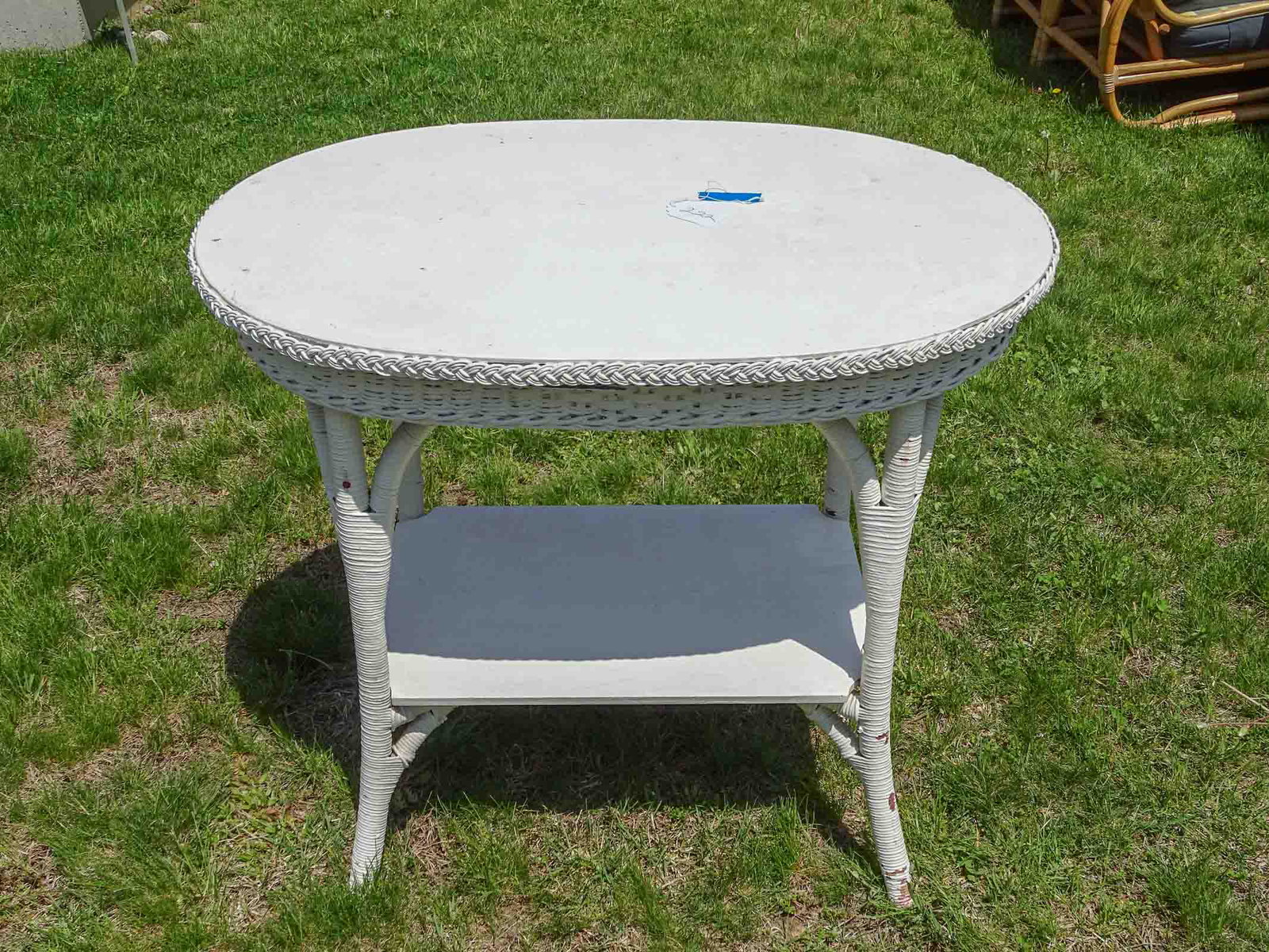 Wicker Table: Oval wicker table 36" x 24" x 31" Ht..