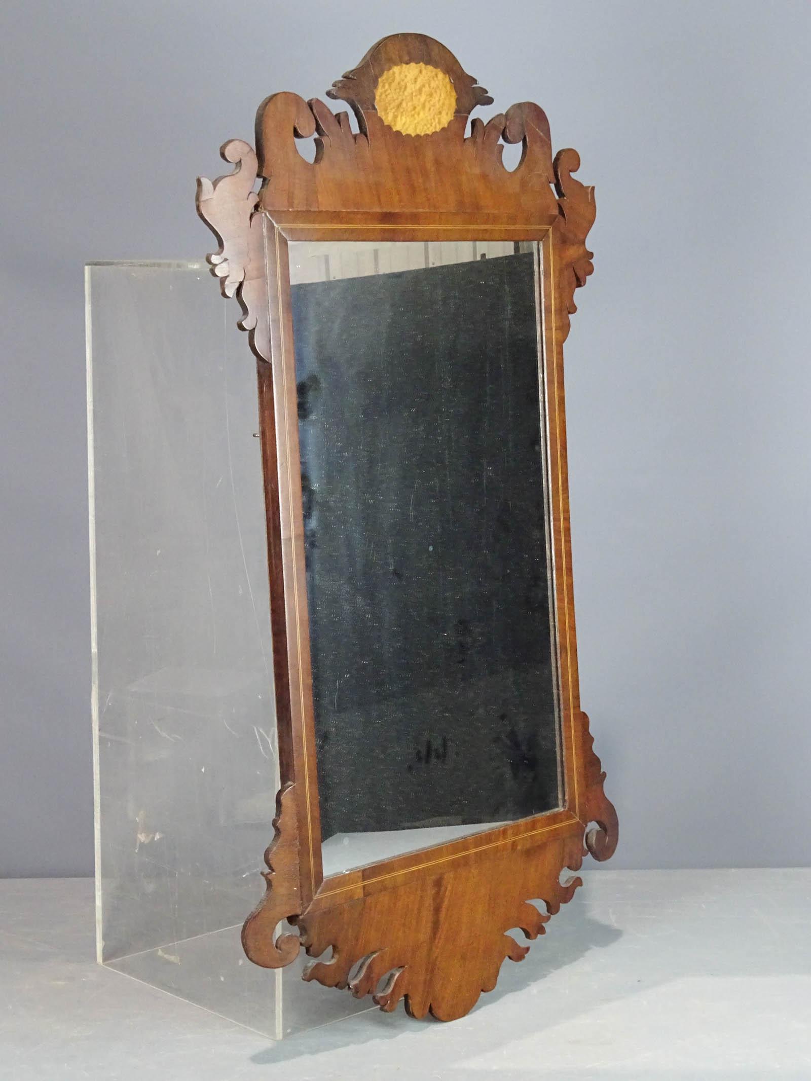 Looking Glass: Chippendale mahogany inlaid looking glass. 35" x 21".
