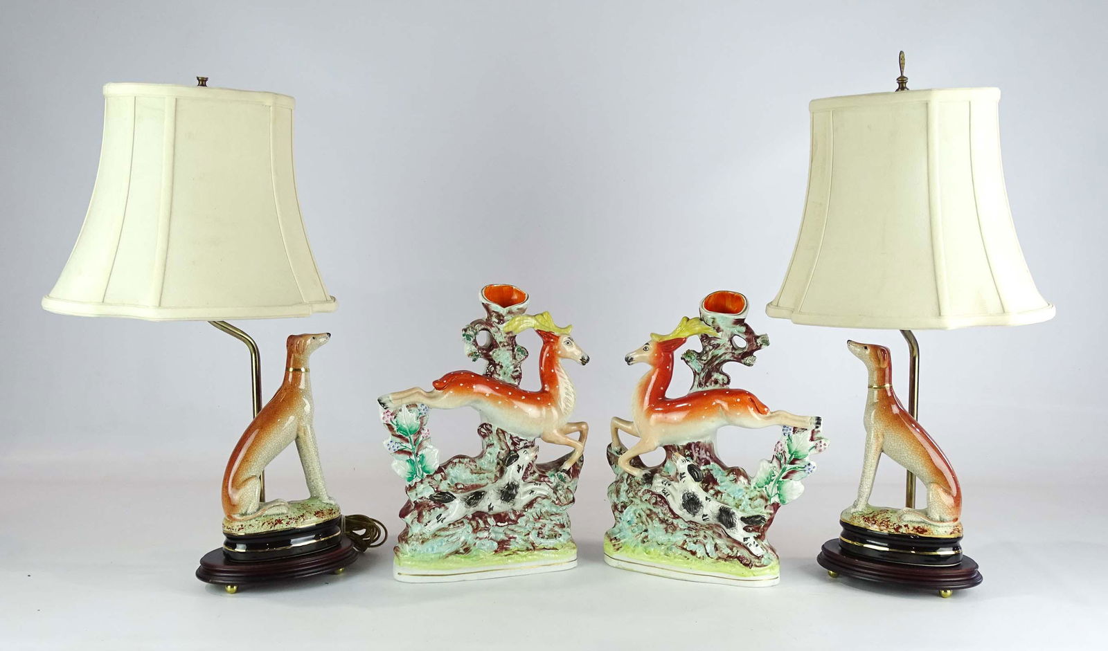 Staffordshire Lot: Staffordshire lot including: pair of whippet dog lamps 21" Ht. and a pair of leaping stag bud vases 12" Ht..