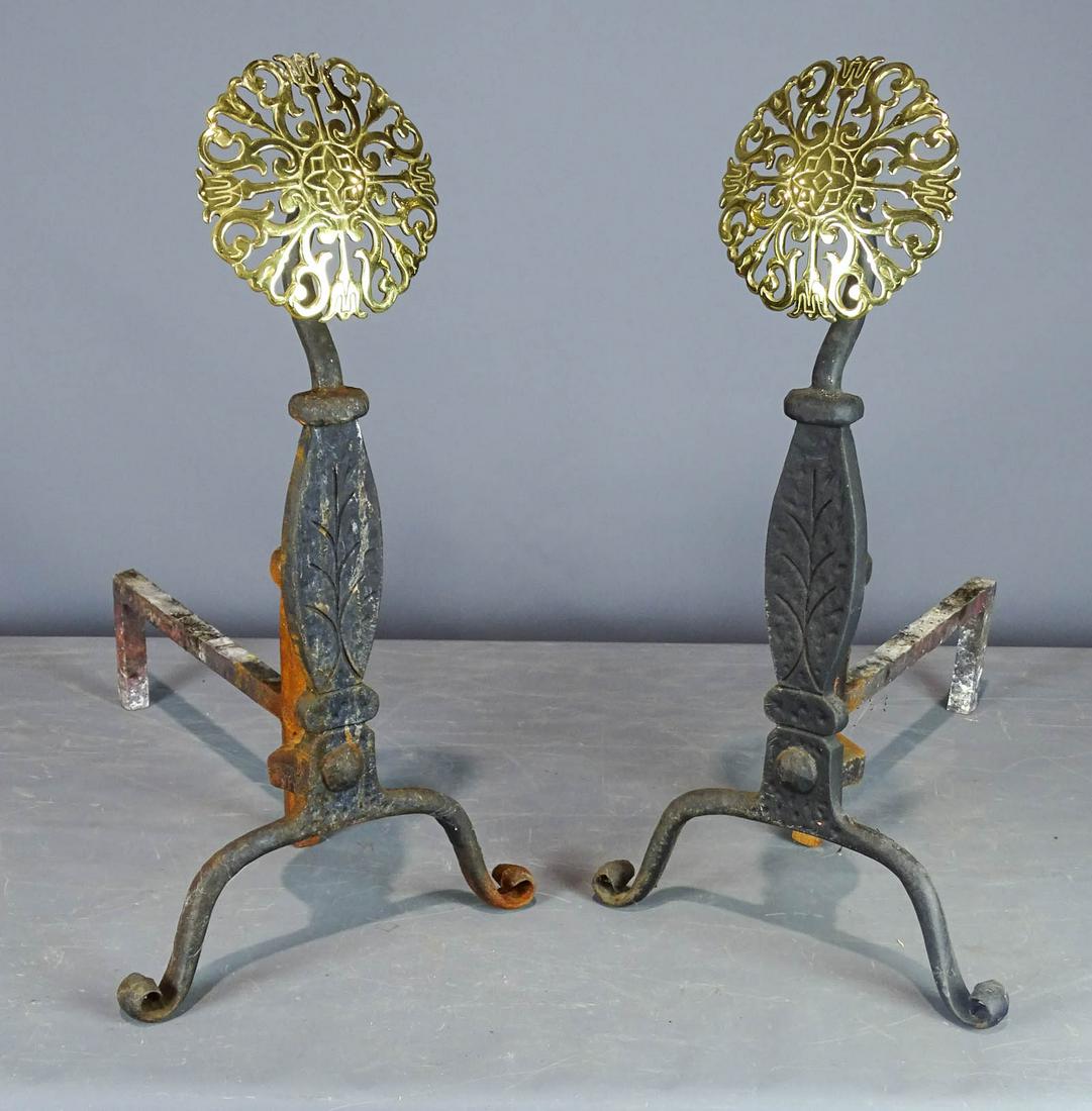 Pair of Andirons: Pair of cast iron and brass andirons. 23" Ht. x 20" D..