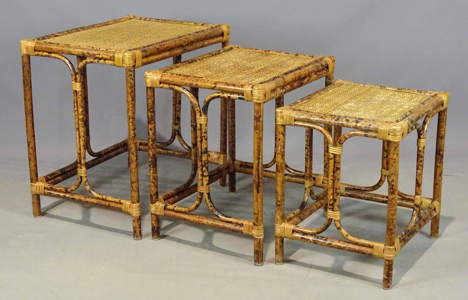 Nest of Bamboo Tables: Nest of (3) bamboo tables. Largest 22" x 16" x 22".