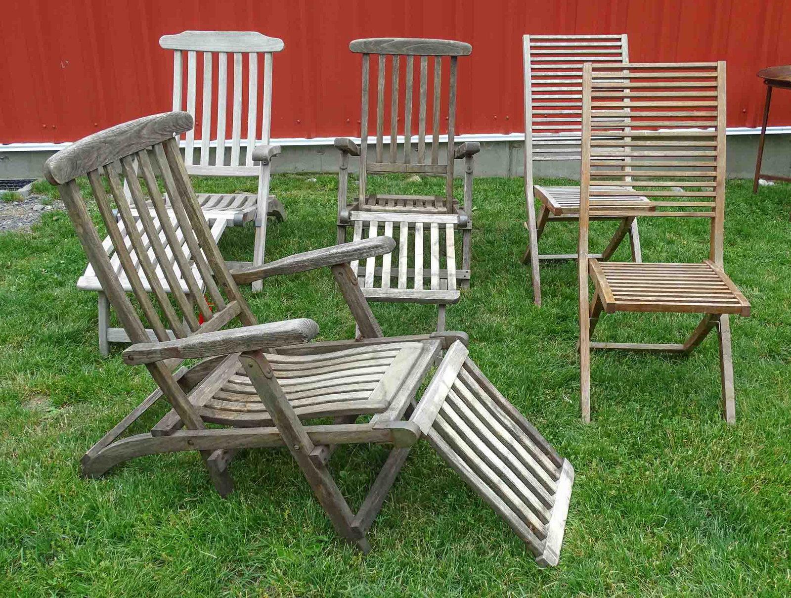 Teak Lounge Chairs: Five teak lounge chairs.