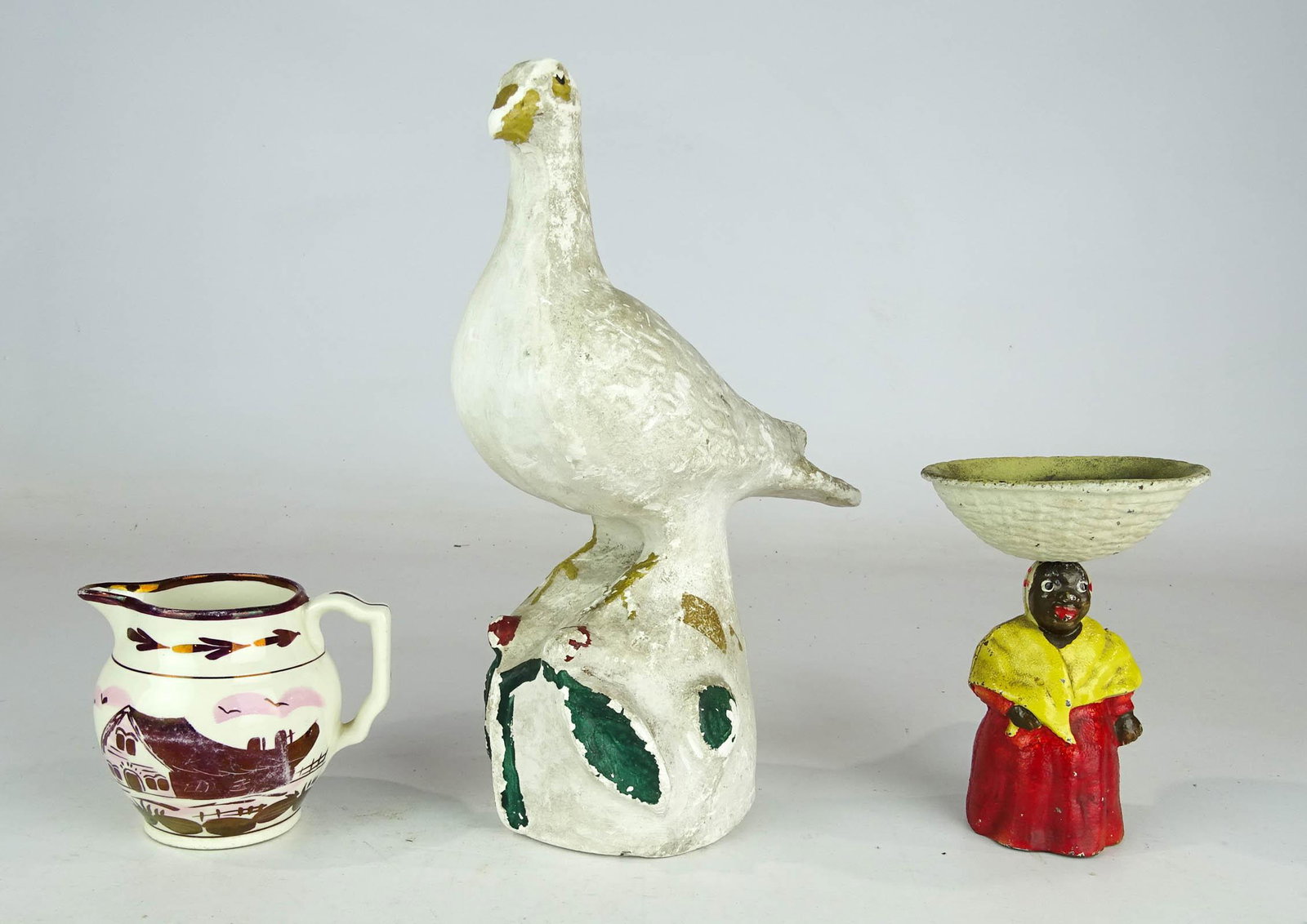 Misc. Lot: Lot including Lusterware pitcher, cast iron Mammy and chalkware dove.