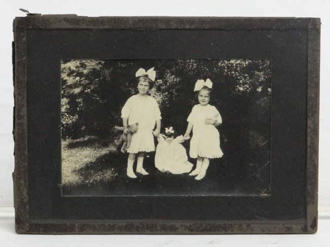 Photo of Children: C. 1905-10 photo of children playing with teddy bear. Image 3 1/8" x 4 3/4".