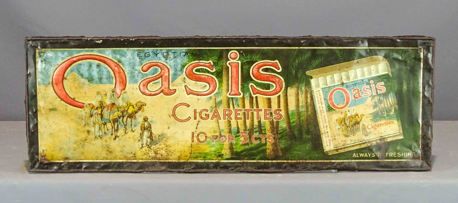 Oasis Cigarettes Sign: Early metal Oasis Cigarettes sign. 13" x 39".