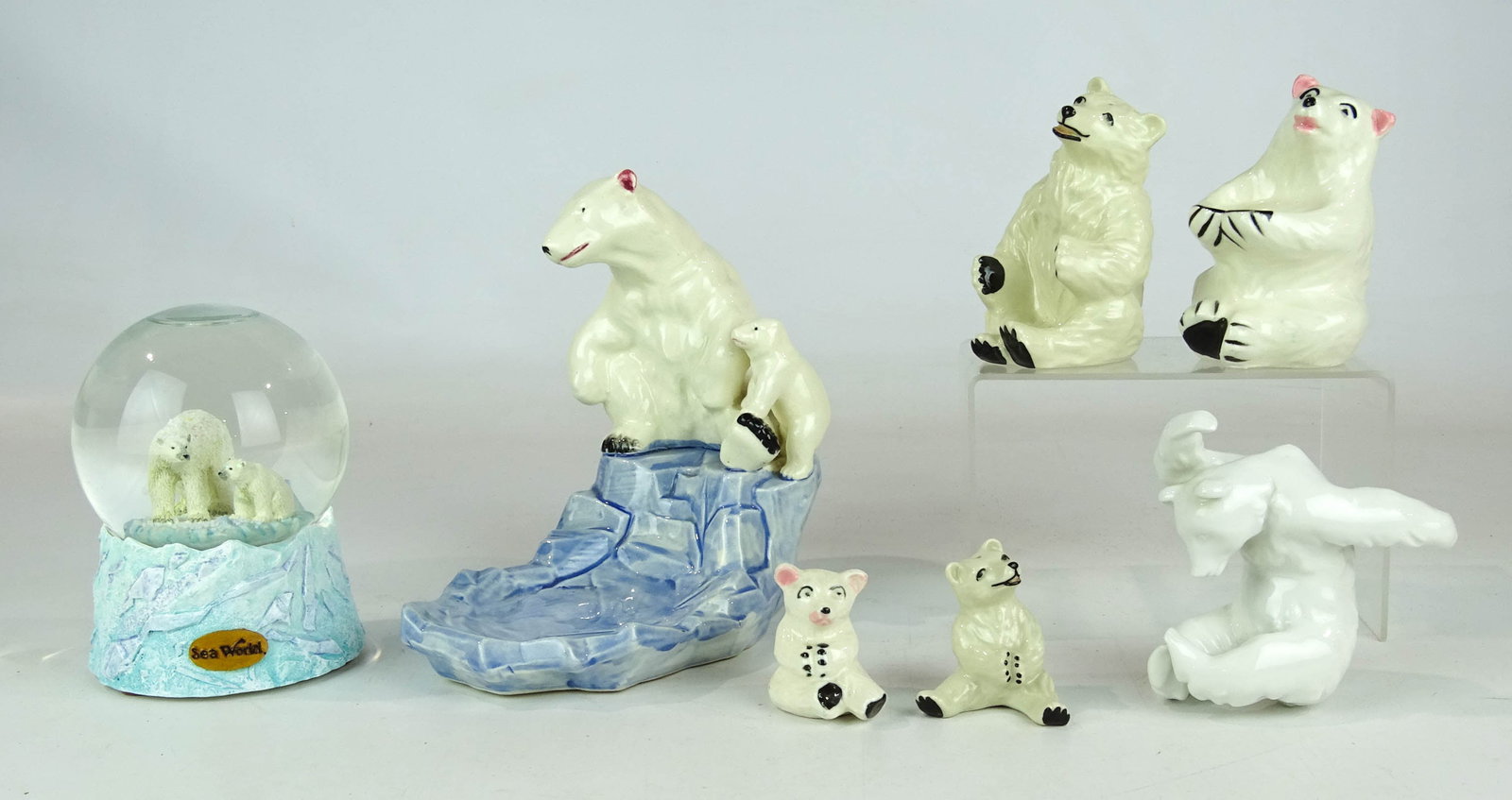 Porcelain Polar Bears Lot: Lot including (6) porcelain polar bears (tallest 7 1/2" Ht., all signed), along with snow globe.