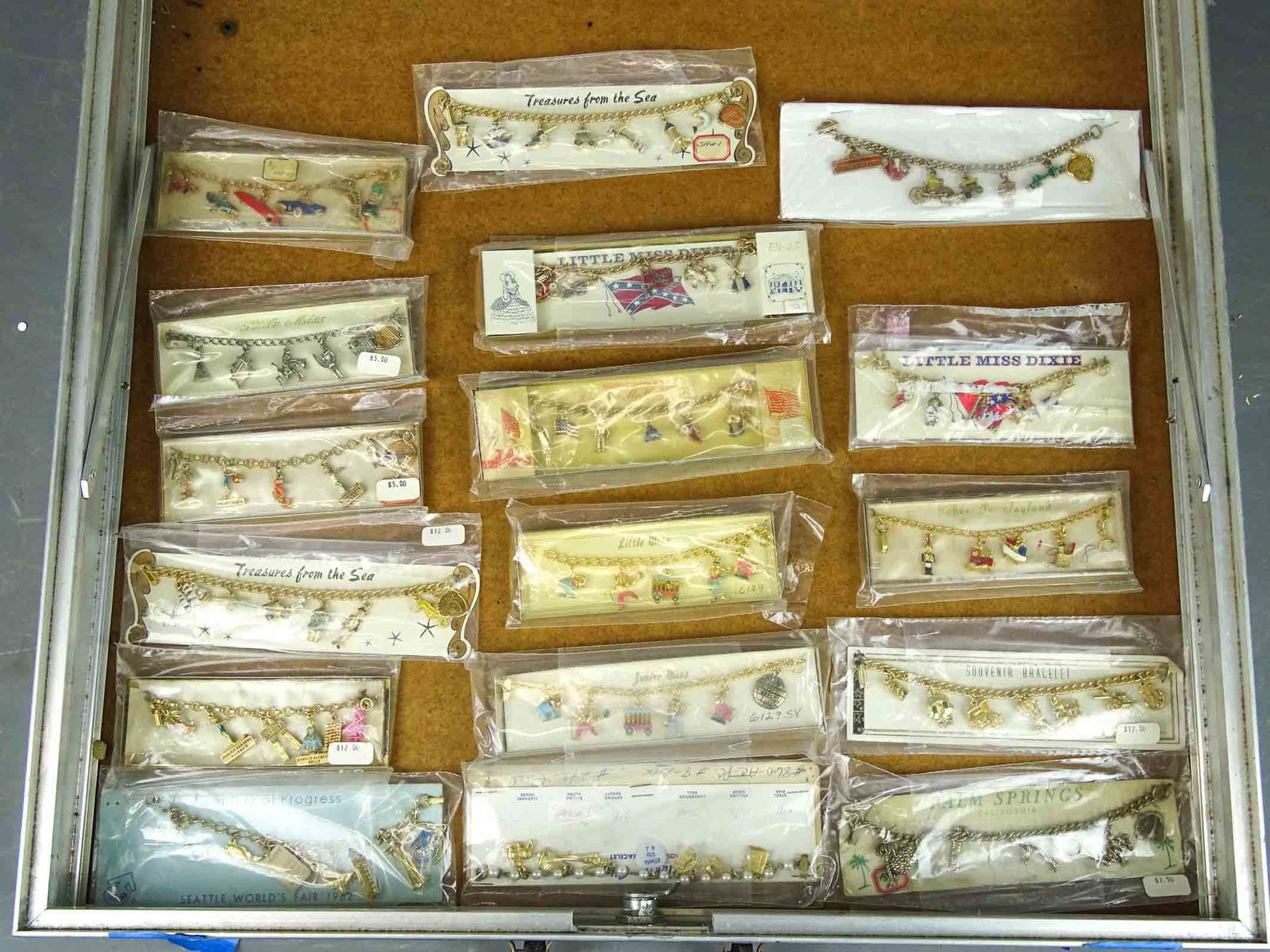 Jewelry Lot: Lot of charm bracelets in original packaging. Case not included.