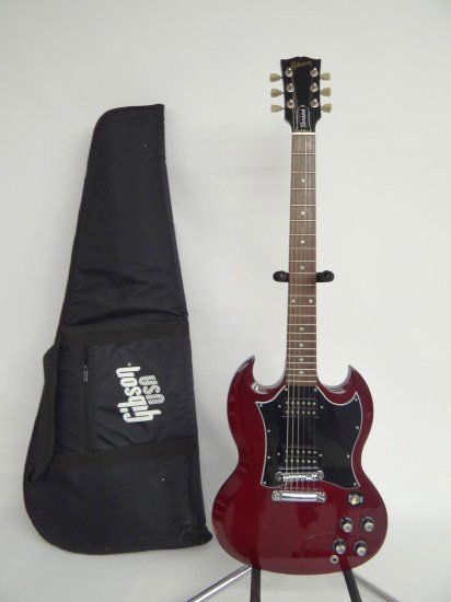 Gibson SG Guitar: Gibson SG Standard #00693305 electric guitar. Made in USA C. 2003. Recently set up. Neck profesionally repaired. Comes with soft case.