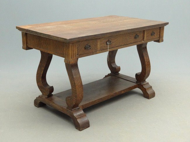 Oak Desk: C. 1920's oak three drawer desk. Top 48" x 27 1/2", 29 1/2" Ht.