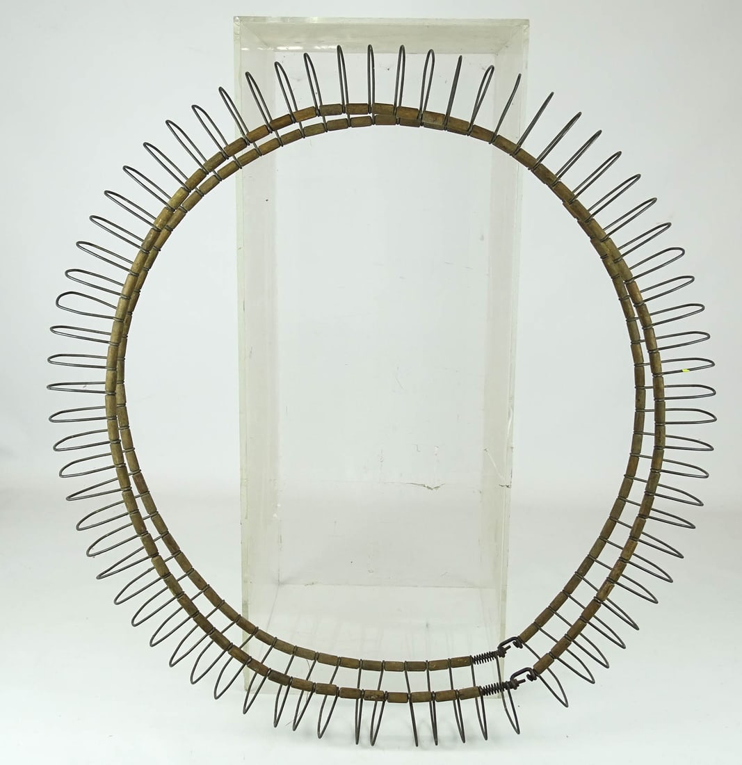 Spring Wheel Cover: Unusual spring wheel cover. Good condition. Collection of Margaret Ann Baker.